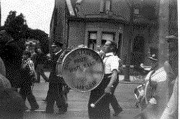 Neil McAllister with bass drum. On the way back to Clarkston, Neil played every instrument in the band. Note that at this time the POC were a Prize band