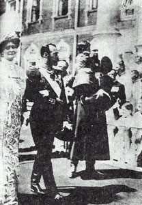 Nicholas and Alexandra celebrating the Tercentenary with a Cossack soldier holding Alexei