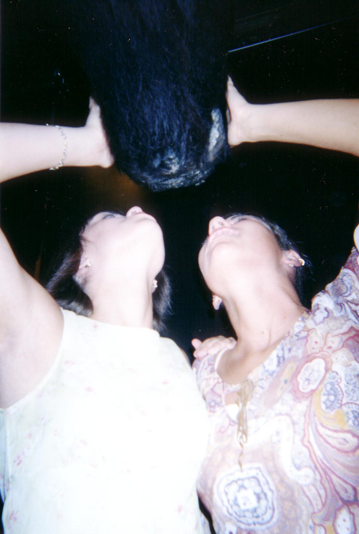 Katie and Jessica macking on a buffalo.  That's twisted.