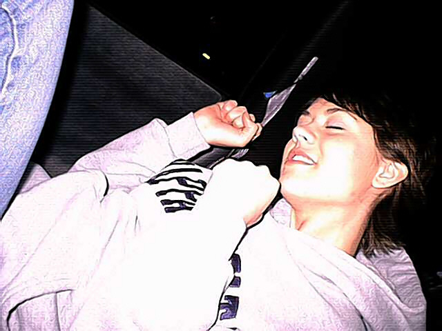 Moon Unit busting to techno in Dweezil's car .