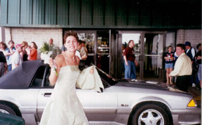 Jessica getting out of Ryne's mustang at prom senior year.