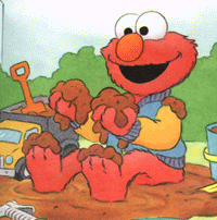 Elmo playing with mud