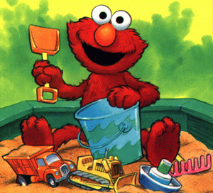 Elmo playing in the sand