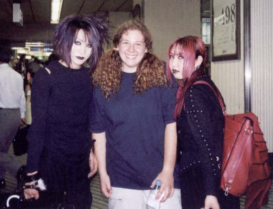 Japanese goths. They were the ONLY non normal people I saw my whole time there, and it wasn't like I was in a not hip place, I was in the 3rd biggest city! The girl actually has her lower eyelid pierced, you can't tell from the picture, because it's her right eye and that side is kind of angled to me. Oh, and the one with the purple hair is a guy.
