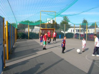 Outdoor Multi-Court, Designed to accomodate a wide range of outdoor sports, from football to basketball. This Area now has a netting cover. The ball always stays in play and in the multicourt. (what a clever idea)
