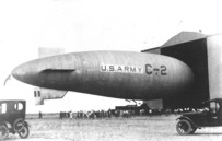 C-2 Airship being moved into the airship
                        hangar at Biggs.