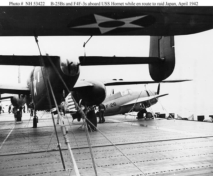 VF-8 F4F-3 Wildcat nestled among Dolittle's B-25s
                aboard the USS Hornet. All aircraft are in early war
                color schemes