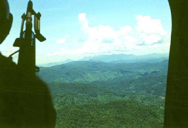 View of the jungled terrain the HMM-365 operated in