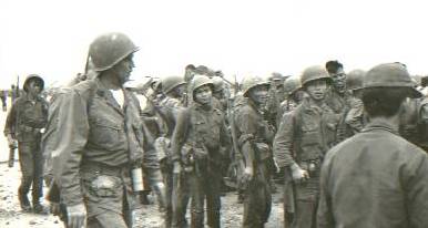 arvn troops and u.s. advisor ready to board hmm-365 helicopters