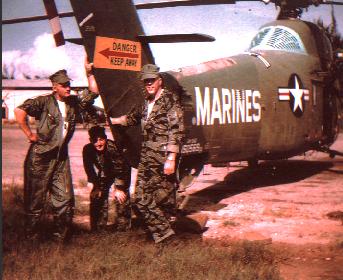 The crew of an HMM-365 helicopter.  LCpl John Williams on the right