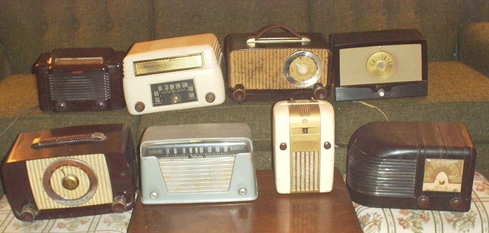 Photo of collection of AA5 radios.