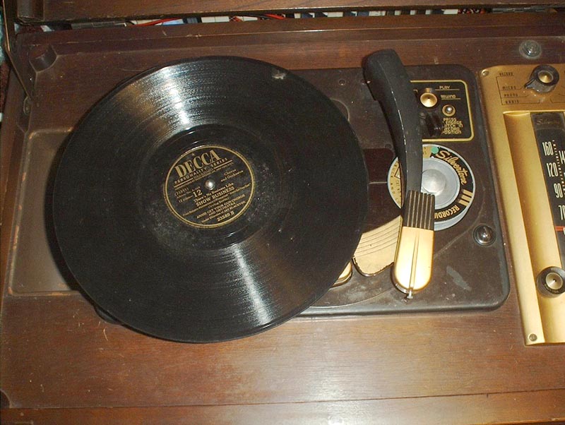  Photo showing a DECCA record on the turntable and the tone arm ready to play.