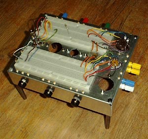 A not so practical new style breadboarding system using IC socket breadboards in conjunction with tube sockets mounted on an aluminum chassis.