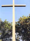 front of the cross
