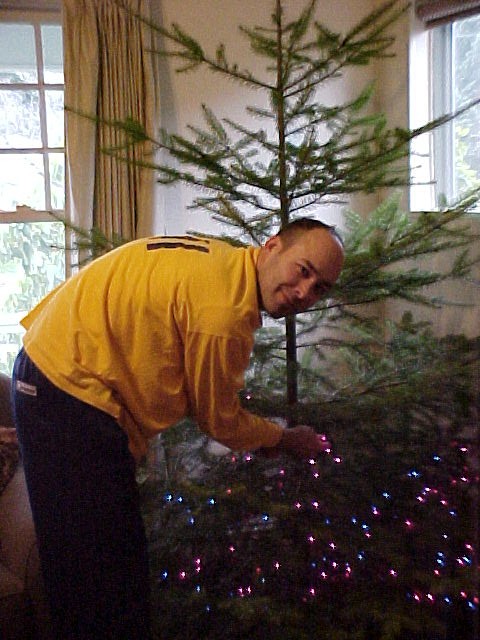 Doug bein cute decorating the Christmas tree