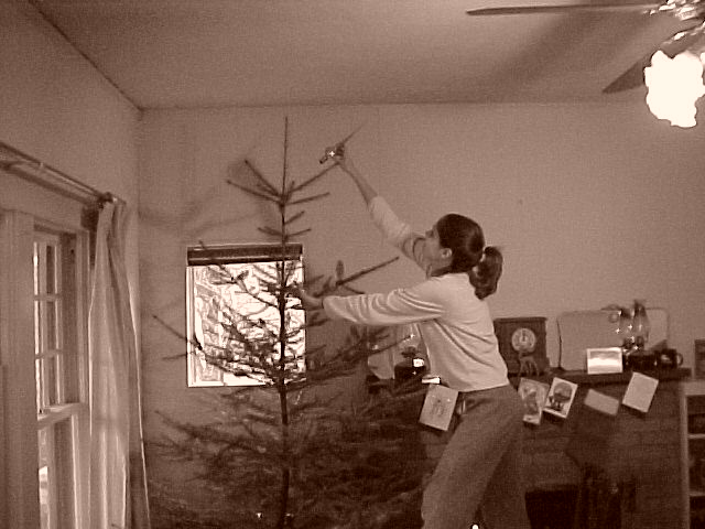 Sarah decorating the Charlie Brown tree!