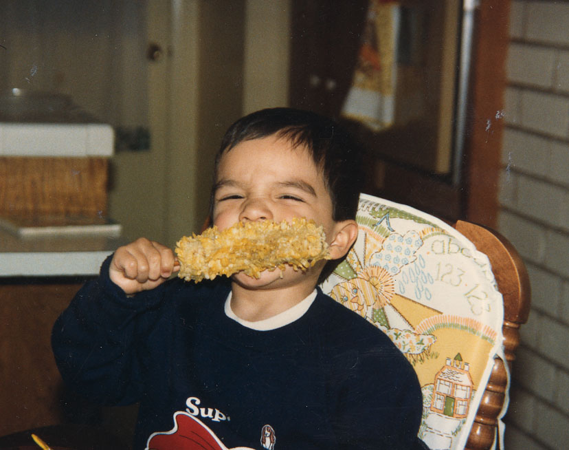 kid jon eating corn