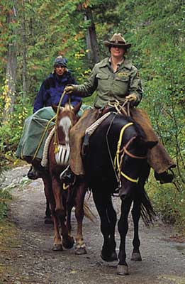 The end of the trail -- A Paradise Mountain guide and guests return from a long day's ride exploring the resorts wilderness areas.
