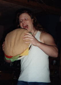 Ken single-handedly working to fight world hunger...one burger at a time.