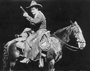Tom Mix rides backwards on Tony