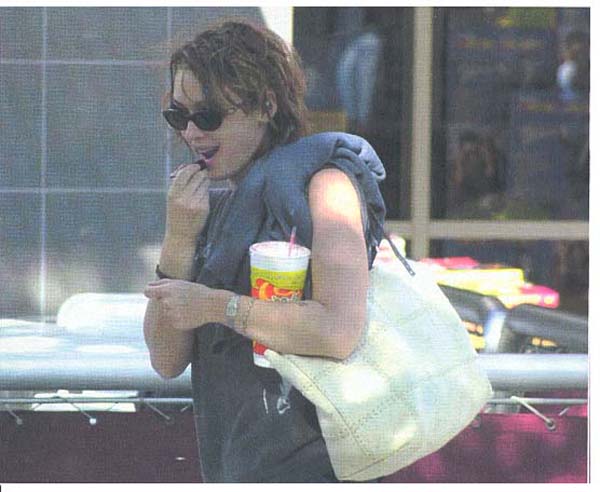 Do you suppose Winona paid for that lipstick? What about the drink? And what's in the bag?