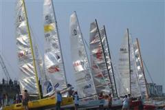Lineup on the beach. Sailors line their sailboats on the beach, talk story, and rest overnight for the next leg of the race.