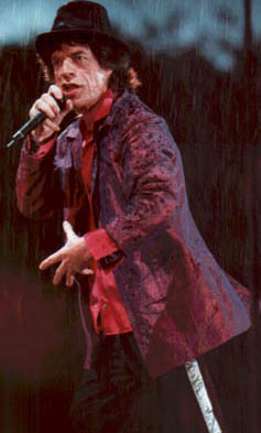 Mick in the pouring rain during the show in the Hague.