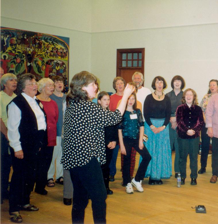 Christine Kydd leads Sangschule and friends at a 'Muckle Sing' event