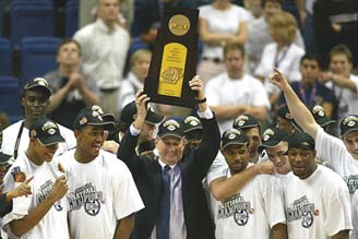 Uconn Team Holding Trophy