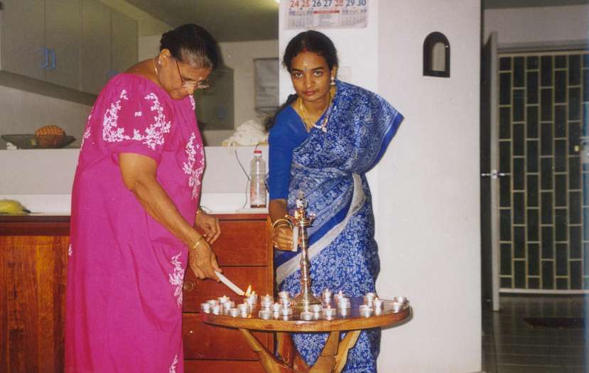 Amma & Raji lighting the candles