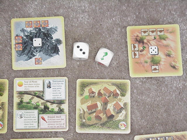 Cards closeup -- settlement  & resources