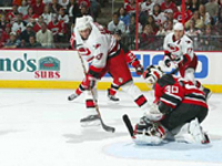 Carolina in for a goal on Martin Brodeur