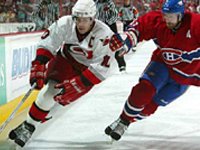 Ron Francis is hassled by a Montr�al player