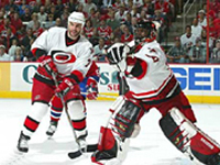 Kevin Weekes comes out for a glove save