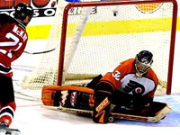 Byron Dafoe makes a save