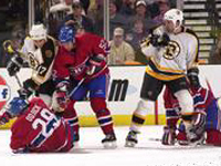 The teams battle for the puck