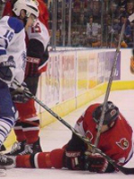 Tucker hovers over a sprawled Ottawa player