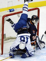 Tucker is upended by Chris Osgood