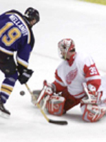 Mellanby puts a shot off of Hasek