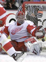 Hasek scrambles for a save