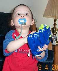 Jonathan with his first baseball mitt from Auntie Andi.