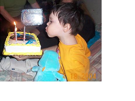 Johnny blowing out his candles.