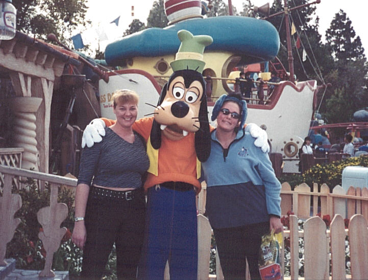 Us with Goofy. I bought those Eeyore ears there. I thought they looked better in the store after I saw these pictures