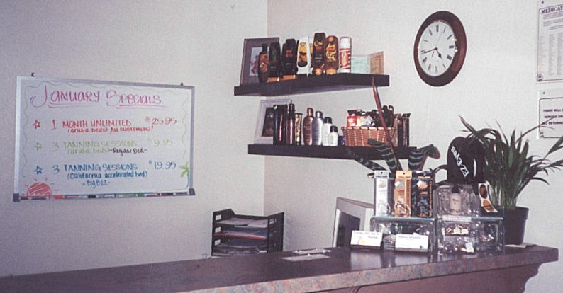 This is the tanning salon I worked at for a year. This was the front counter with the specials listed in the back. It was a cool place to work until the new owners took over. I picked out the plants for the front. Arn't they pretty?