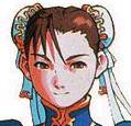 A HA! The similar hair styles did it for me, Chun-li of Street Fighter set the stlye for Lady Une. I mean, put some glasses on Chun-li and you'd have thought those two were twins that were separated at birth or something!
