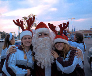 Ashlynn, Santa (Tarl), and Bree at Caroling