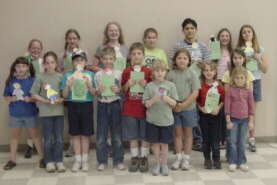 group with dolls and journals