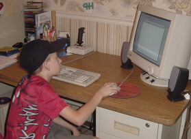 Member designing a 4-H promotion flier.