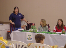 photo of Mrs. McMahon speaking to the club