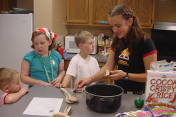 Making Cocoa Krispie Cats.